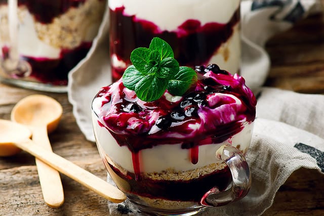 healthy curd cream with berries and flakes